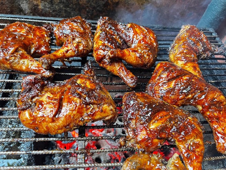 Glazed barbecue chicken pieces straight off the grill