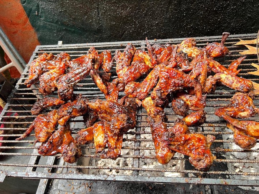 Smoky barbecue chicken wings on the grill